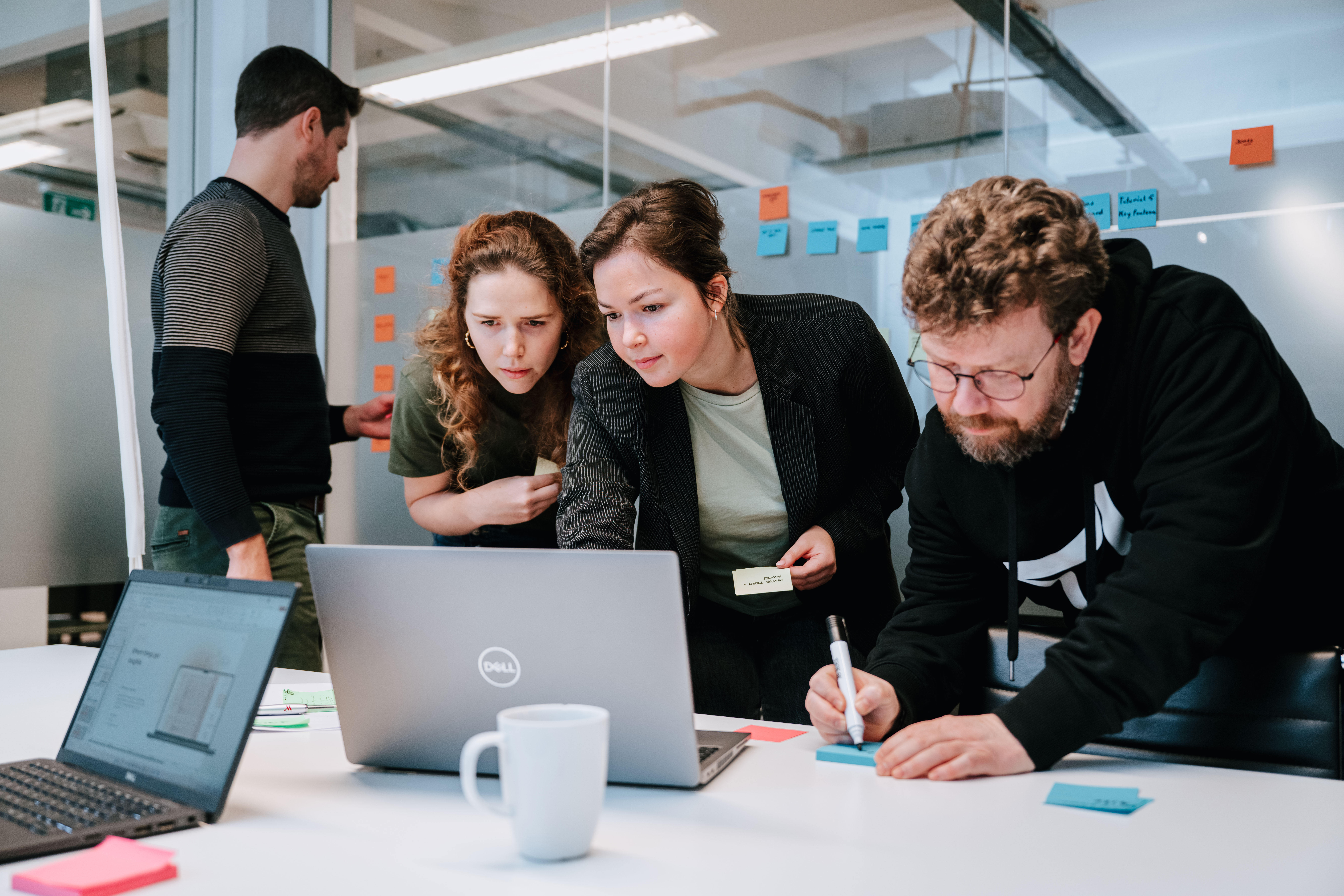 A group of co-workers working together during a workshop