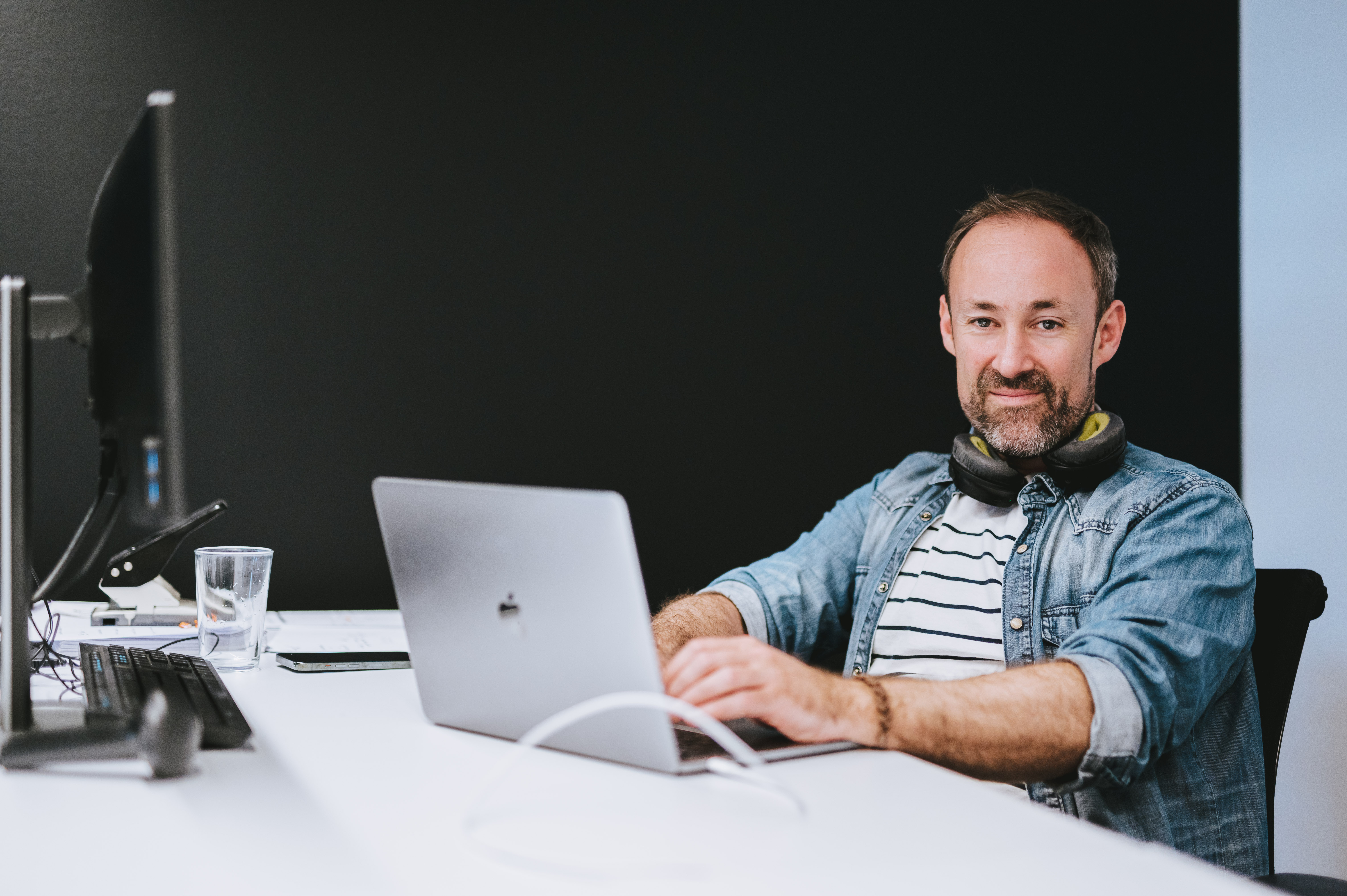 Pieter Van Tendeloo, Strategy Director at The Reference behind his desk