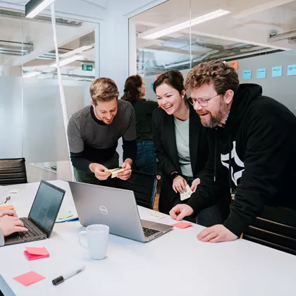 A team of colleagues having fun during a workshop