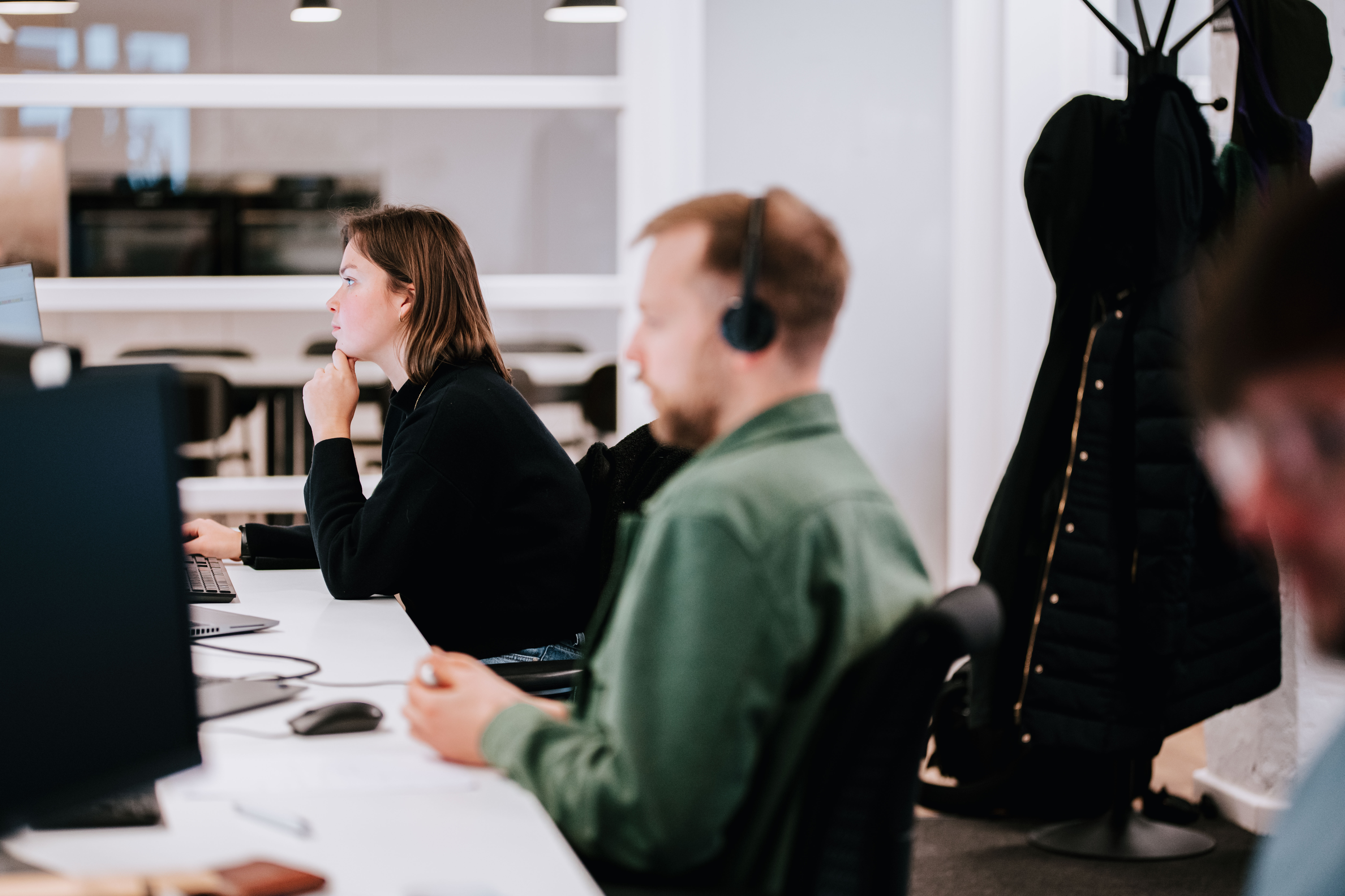 Two people working on their desk